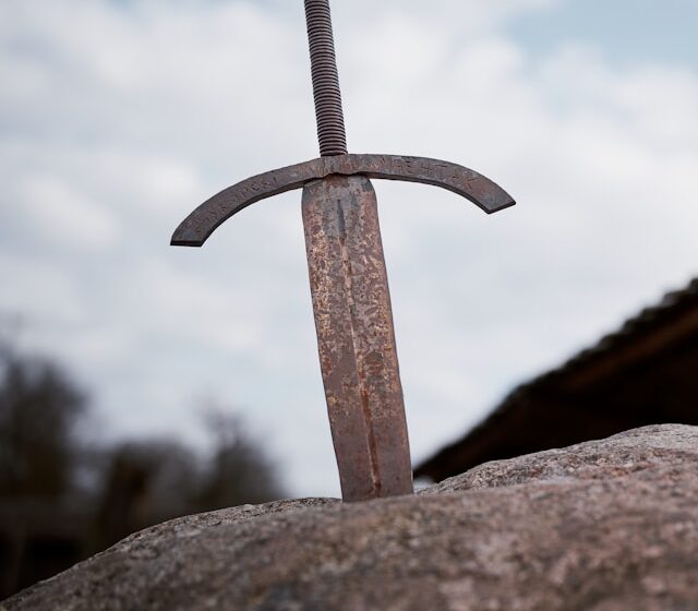 The Chosen One: Why Fantasy Can’t Quit This Trope A rusty sword in a stone, an iconic metaphor for the "chosen one" trope in fantasy fiction.