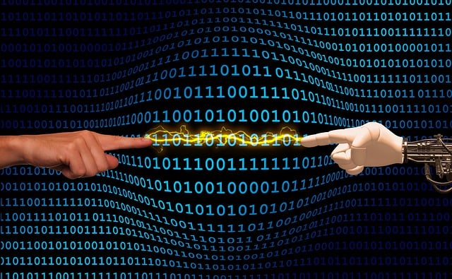 A human hand with index finger extended points toward a robot hand with its index finger pointing back. It's illustrating a symbolic way to contact a human at MetPub.