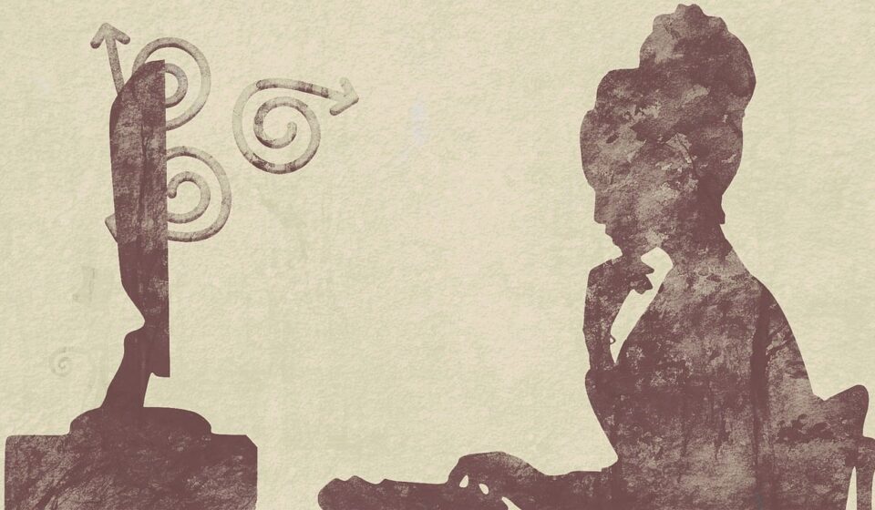 On a neutral background, a silhouette pauses with its fingers on its chin, contemplating a computer screen with arrows spiraling before it. Looks like writer's block, but it might be depression.